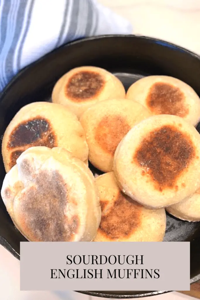 Cast iron skillet with sourdough english muffins inside