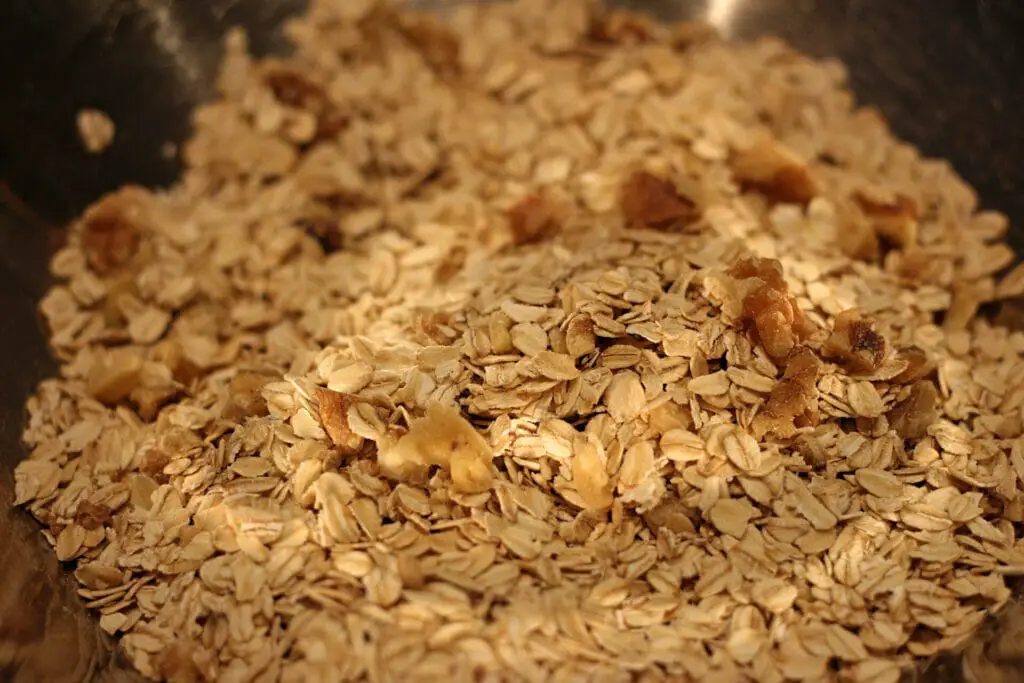 rolled oats and chopped walnuts in a bowl
