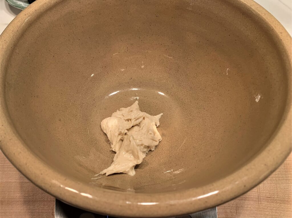 30g dry sourdough placed in a nonreactive bowl on top of a digital scale