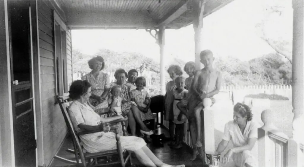 large family sitting on a porch