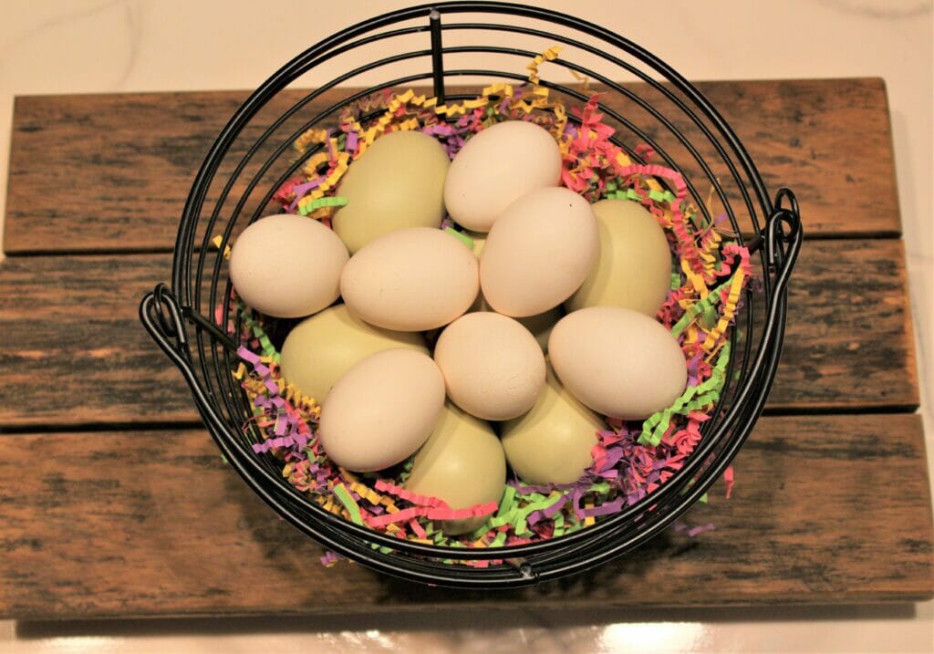 Bantam chicken eggs in an egg basket lined with Easter confetti