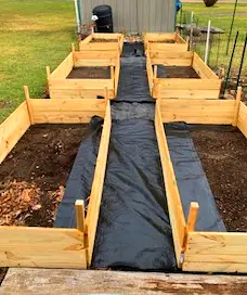 six 1ft by 3ft by 6ft raised garden beds made out of wood