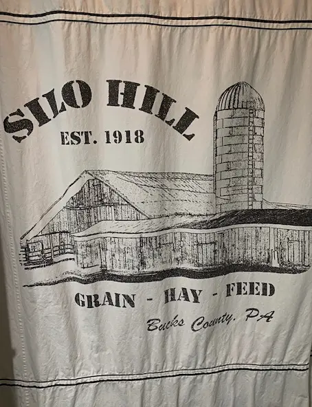 shower curtain made of drop cloth depicting an old barn with a silo
