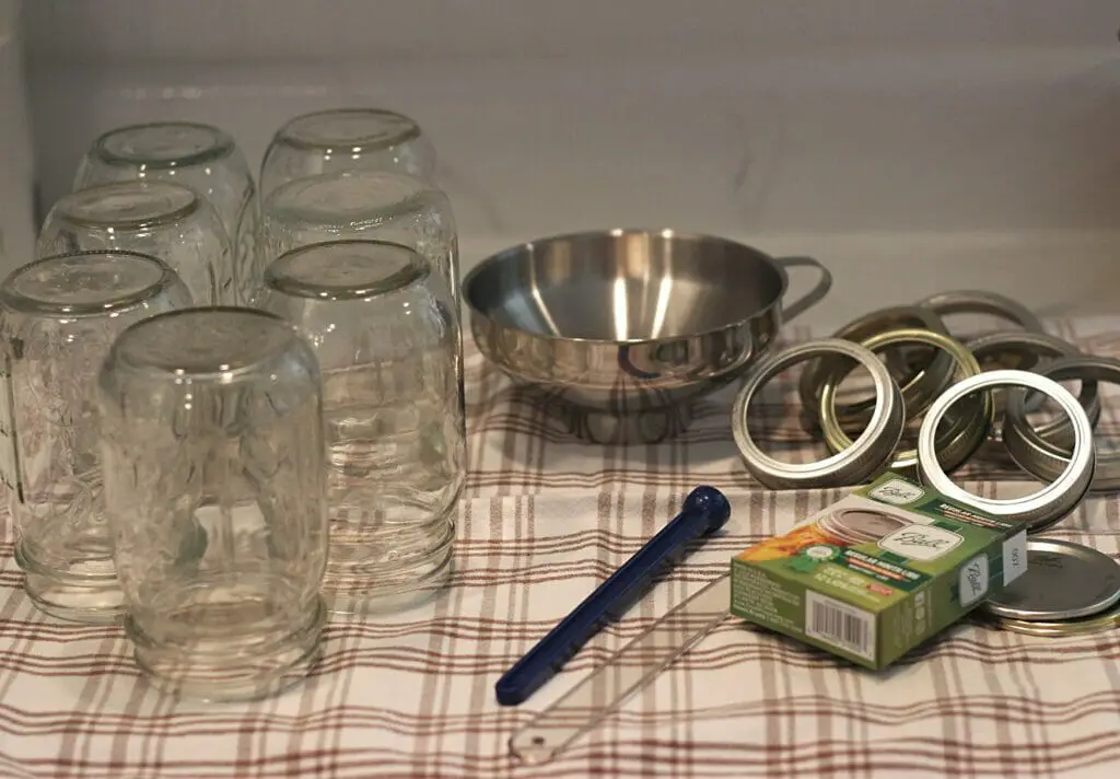 Glass jars, canning lids, bands, funnel for canning meat