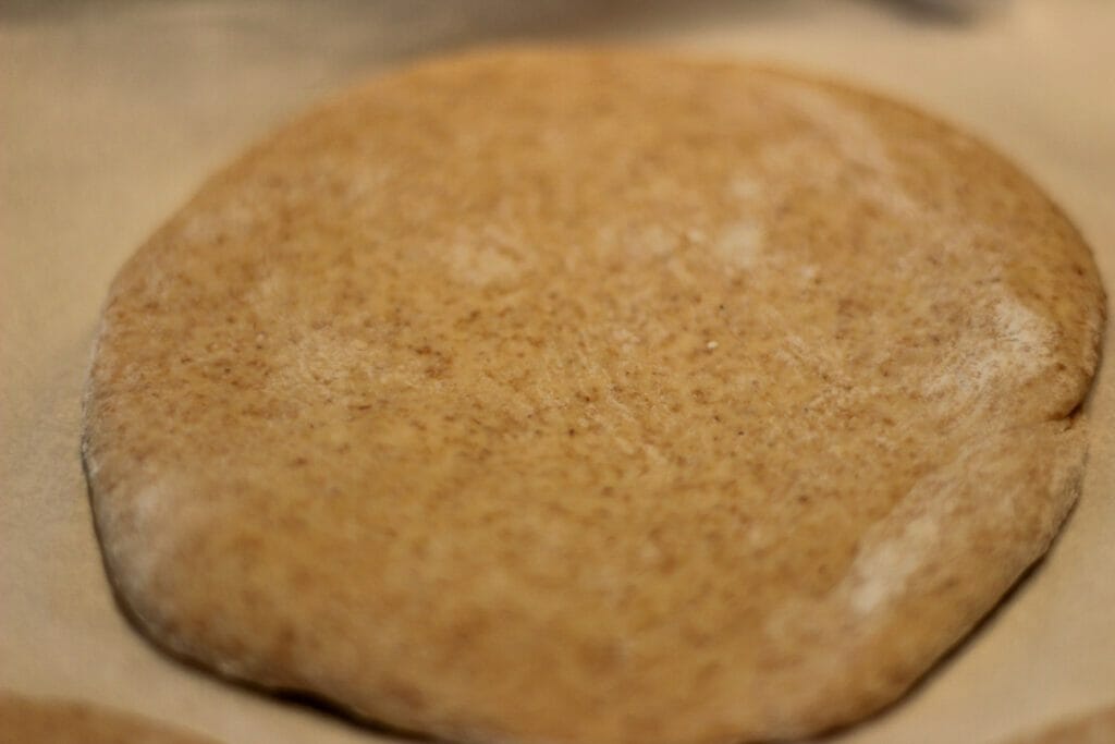 whole wheat pita dough rolled out into 1/4" thickness