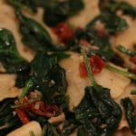 mushroom ravioli with spinach and sundried tomatoes