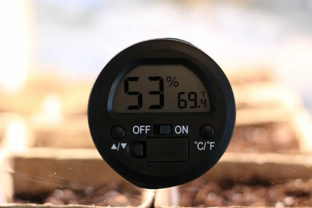 temperature and humidity gauge on the indoor greenhouse
