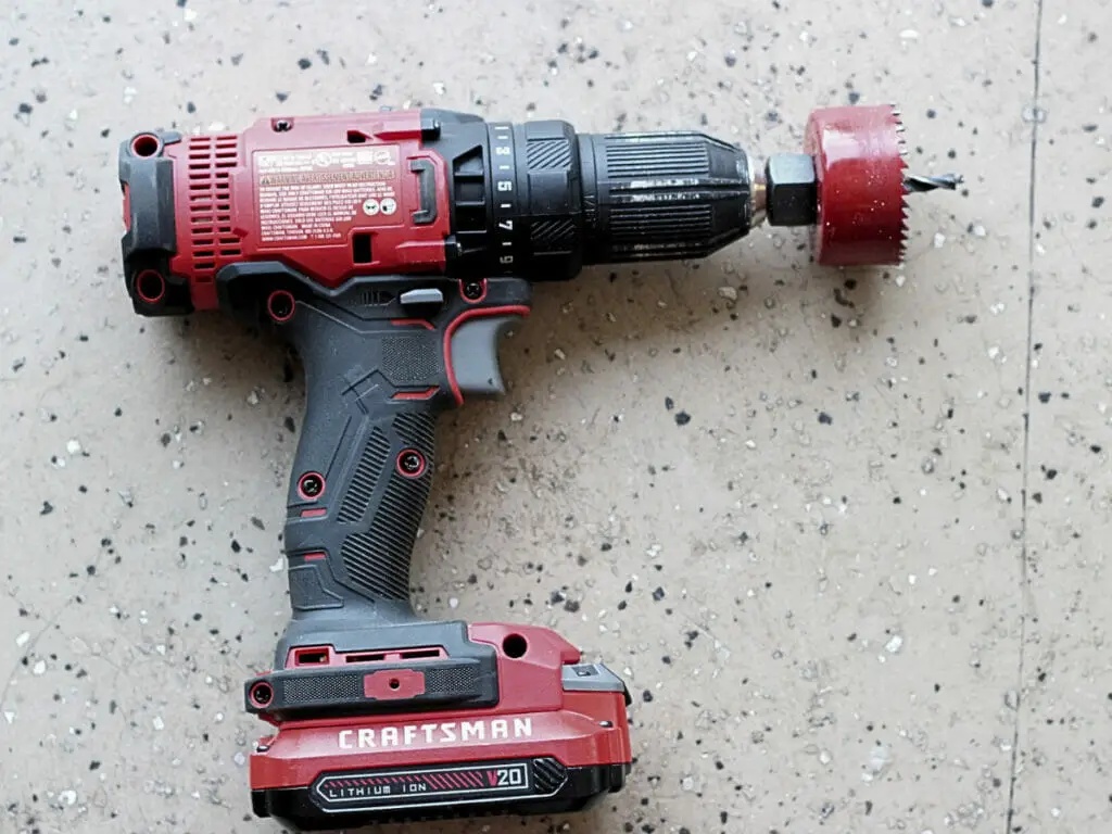 drill with 2 1/8" hole saw attachment
