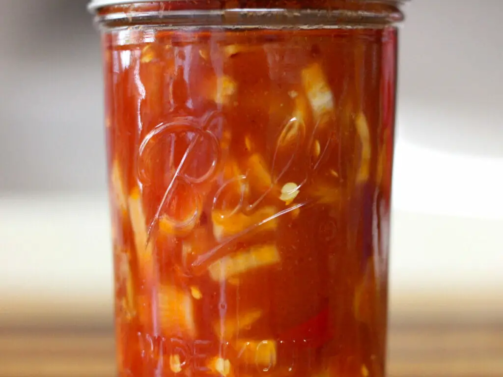 jar of canned hot pepper rings in red sauce
