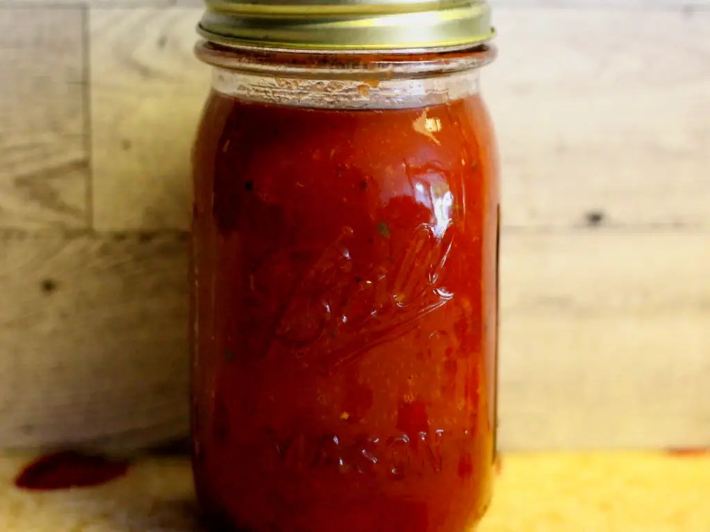 Jar of homemade overnight roasted tomato sauce