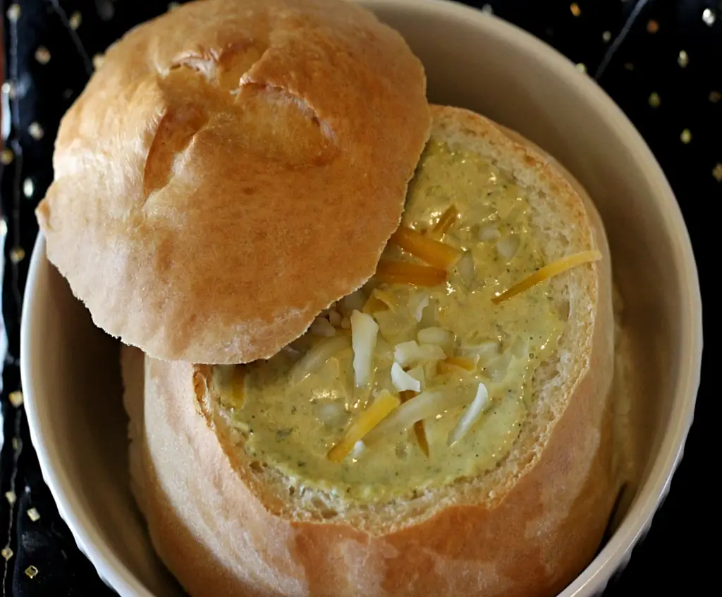 Homemade bread bowl filled with broccoli cheese soup