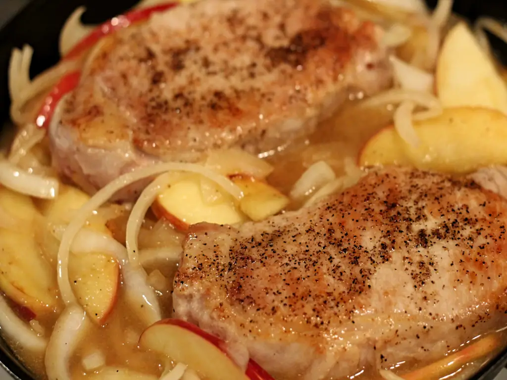 seared pork combined with apples onions and thickened sauce