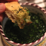 sourdough focaccia bread in herbed dipping oil