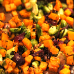 roasted butternut squash and brussels sprouts with red onion cranberries and pecans