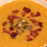 pumpkin soup with pumpkin seeds and bacon