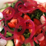 fermented red onions topping a salad