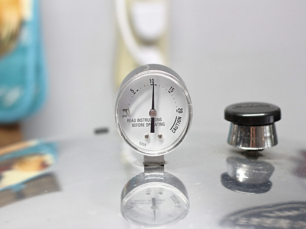 pressure canner gauge showing 10 pounds of pressure
