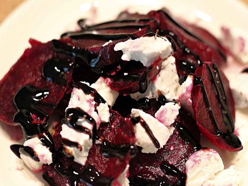 beets and cheese topped with balsamic glaze