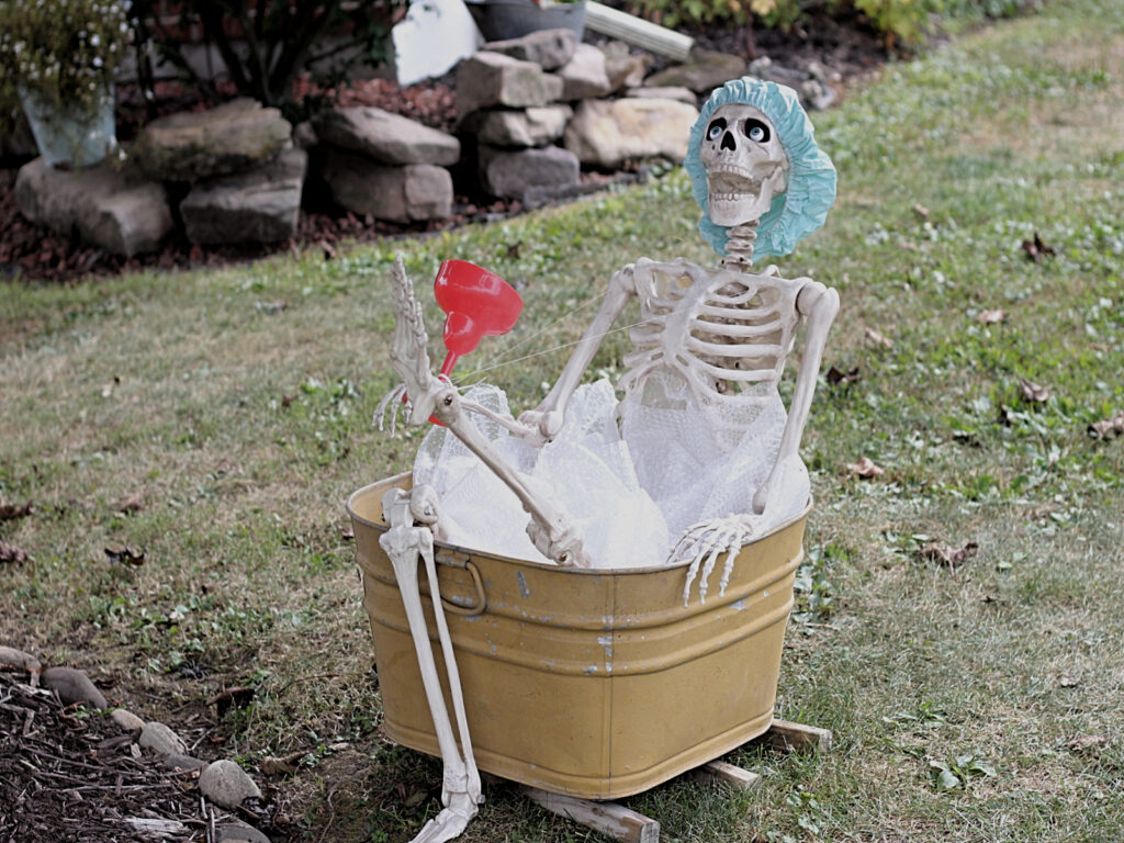 skelly taking a bath in a washtub