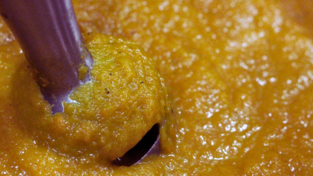 soup being blended with stick blender