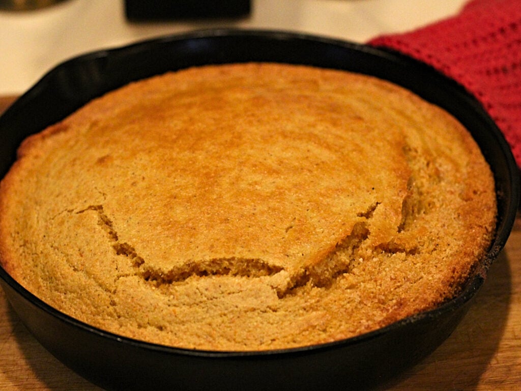 cast iron skillet with sourdough cornbread